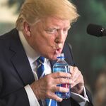 Trump drinks something.jpg