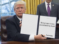 Trump signs papers traps punishable by death.png