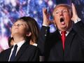 Donald Trump reacts next to Barron Trump.jpg