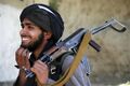 Taliban-militant-smiles.jpg
