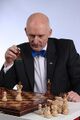 Janusz Korwin-Mikke playing chess.jpg