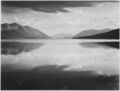 792px-Looking across lake toward mountains, -Evening, McDonald Lake, Glacier National Park,- Montana., 1933 - 1942 - NARA - 519861.jpg