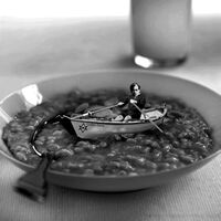 Aleister Crowley rowing his boat "Golden Dawn" in a plate full of porridge.jpg