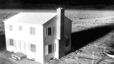 Exploding house (animation of nuclear weapon testing).gif