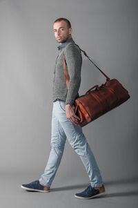 Man wearing leather bag.jpg