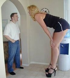 A typical Amazon Woman towering above a man above 6 foot.